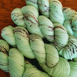 Hand Dyed Yarn Sparkle Fingering - Mint Chocolate Chip - 100g 438 yd SW Merino/Nylon or Sparkle - Mint Green with Chocolate Speckles
