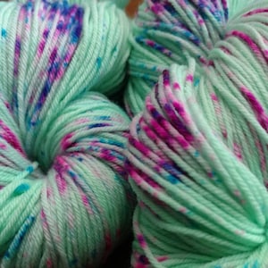 Hand Dyed Yarn Fingering Sock - Cosmic Girl - SW Merino/Nylon Sparkle or Cashmere Blend  - mint green w/fuchsia and turquoise speckles