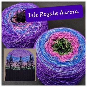 May include: A skein of purple, blue, pink, and green yarn with a knitted hat made from the same yarn. The yarn is called "Isle Royale Aurora".