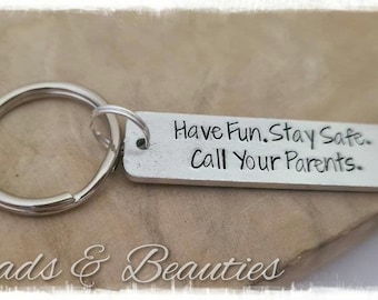 May include: Silver keychain with a silver tag that reads "Have Fun. Stay Safe. Call Your Parents."