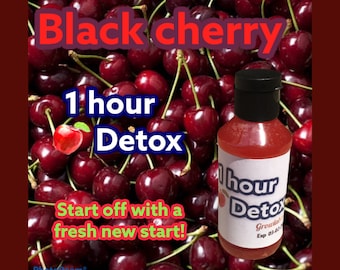 May include: A red glass bottle with a black cap and a white label that says "1 hour Detox" and "Growla" with a black cherry background.