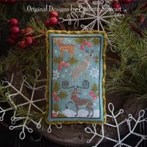 May include: A cross stitch sampler pattern featuring a winter scene with three deer and a blue background. The pattern is titled "Rack Stack" and is part of the Plum Street Samplers collection.