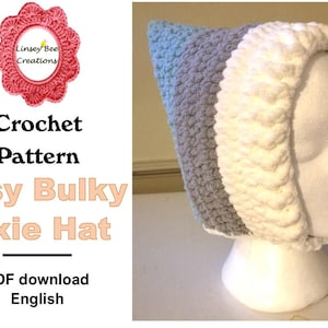 May include: A crochet pattern for an easy bulky pixie hat. The pattern is available as a PDF download in English. The hat is shown in white and grey yarn.