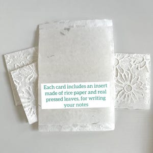 May include: A set of three blank cards with a textured surface. Each card includes an insert made of rice paper and real pressed leaves, for writing your notes.