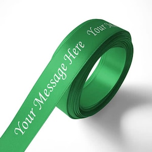 May include: A roll of green satin ribbon with white text that reads "Your Message Here Your Message".
