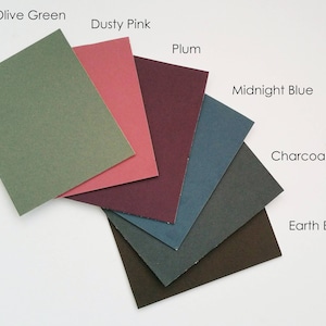 May include: A collection of six color swatches in shades of olive green, dusty pink, plum, midnight blue, charcoal grey, and earth brown.