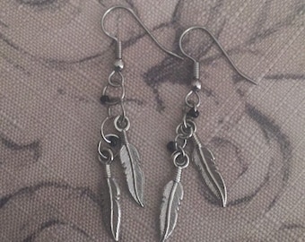 Feather charm earrings