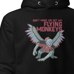 May include: Black hooded sweatshirt with a graphic of a winged monkey and the text "Don't make me get my flying monkeys".