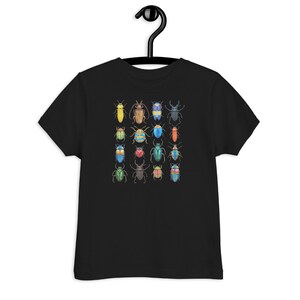 May include: Black t-shirt for kids featuring a colourful pattern of various beetles. The beetles are drawn in a watercolour style and are arranged in a grid pattern.