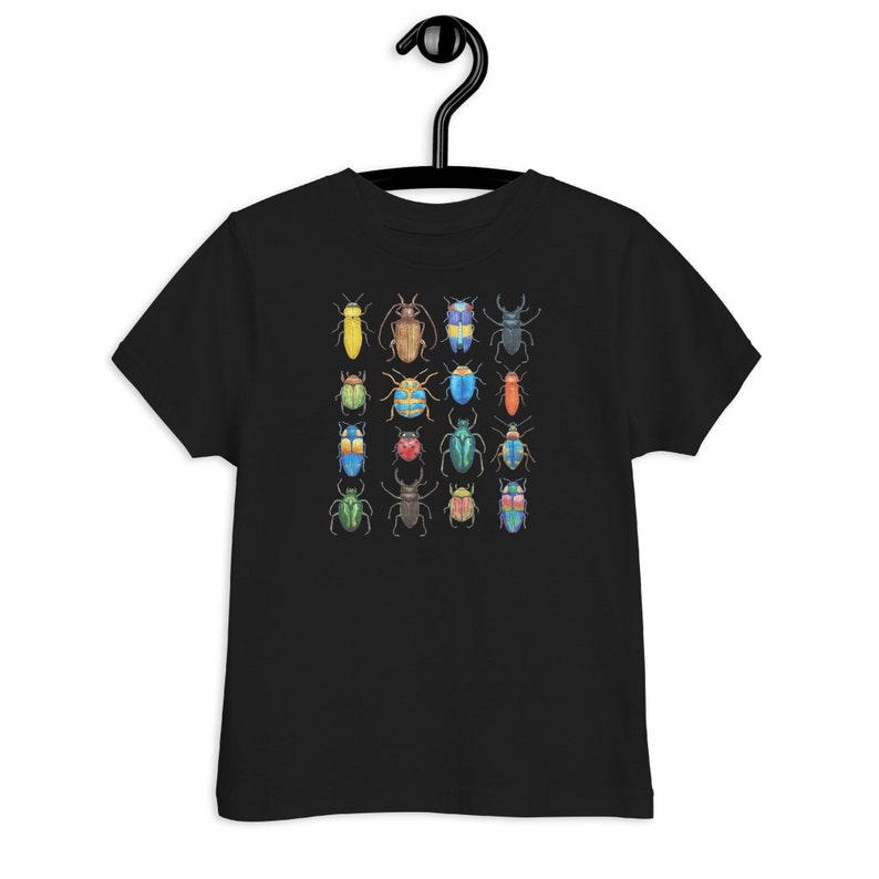 May include: Black t-shirt for kids featuring a colourful pattern of various beetles. The beetles are drawn in a watercolour style and are arranged in a grid pattern.