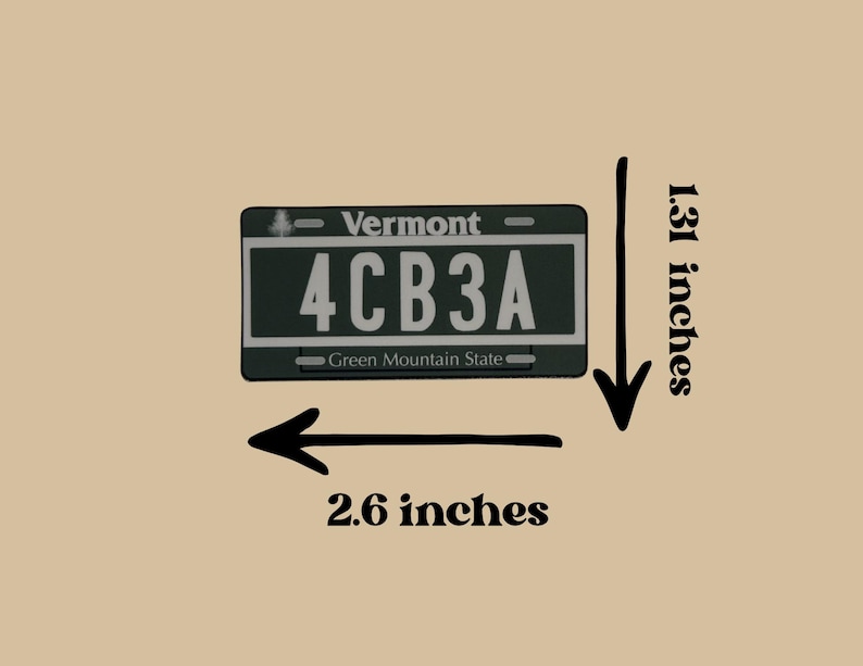 May include: A rectangular Vermont license plate replica featuring the text 4CB3A, Vermont, and Green Mountain State. The plate measures 2.6 inches in width and 1.31 inches in height as indicated by the black arrows and text labels on the image.