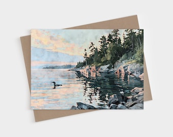 Tarjetas de notas plegables en blanco con diseño de colimbo del lago Superior, papelería con acuarela de atardecer en tonos melocotón, azul y verde.