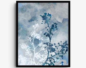 May include: A framed wall art print featuring a watercolor-style background in shades of blue, gray, and white. The composition displays a silhouette of botanical branches in dark blue and a contrasting white floral pattern overlay.