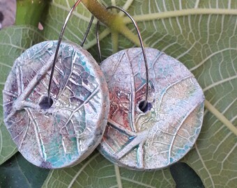 round raku ceramic earrings with plant imprints