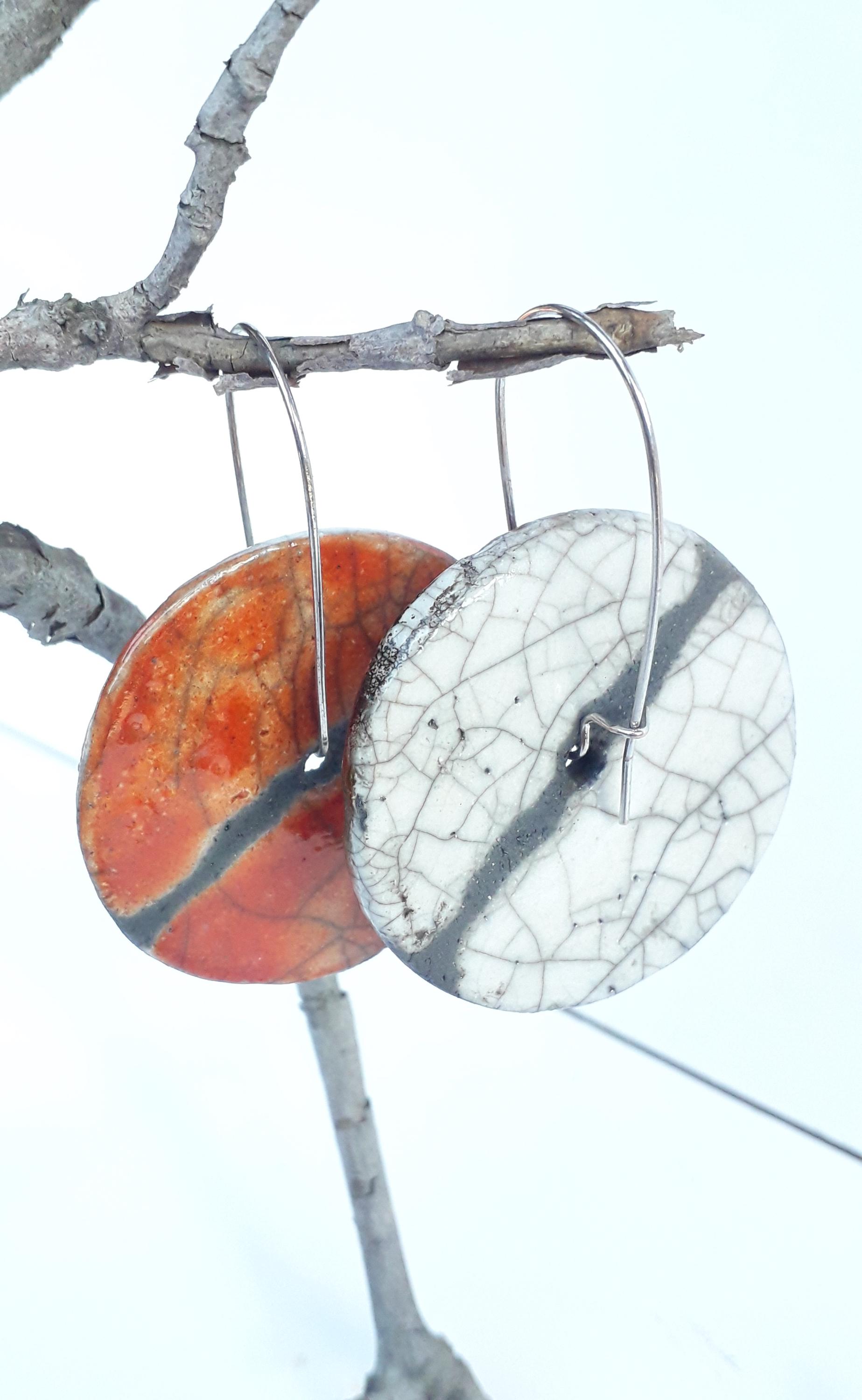 Two-tone red and white raku ceramic disc-shaped pendant earrings