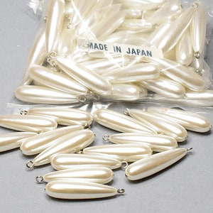 Pearls. NOS. 30x8mm. Vintage Tear Drop Pearl with Loop. sold by 12 pieces per pack.