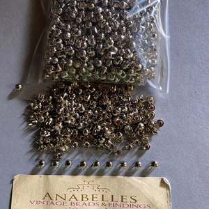 Metal findings. NOS. 4mm NH. Dome shaped nail heads. Sold by lots of 500 pieces.