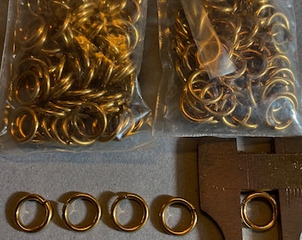 Jump Rings. NOS. 9.5mm metal rings. Sold by ounce.