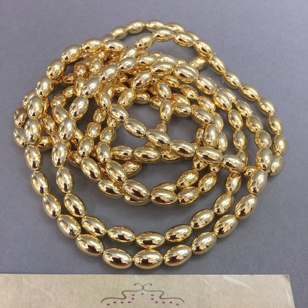 Beads. NOS. 9x6mm Lovely Gold Oval Pearls. Temporarily Strung 60". Sold by strand