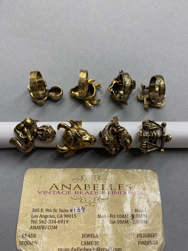 Metal findings. NOS. Constellations Rings. Rings. Adjustable Antique Finished Rings. Sold by lots of 4 pieces. 