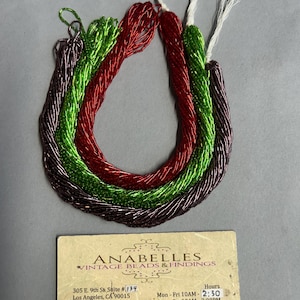 Bugle beads. NOS. 2x1mm. Sold by bunch of 12 strands.