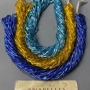 Bugle Beads. NOS. 5x2mm.  #2 Glass bugle beads. Sold by bunch of 12 strands.