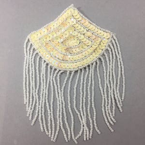 Vintage Appliques. NOS. Fan shape designs. Sold by piece.
