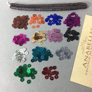 Sequins. NOS. 4mm Lovely, flat style sequins. Sold by strand of 1000 pieces.