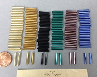 Glass Bugle Beads. NOS. 15x2.5mm sold by lots  of 215 pieces.(1 Ounce)