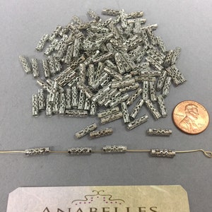 Metal findings. NOS. 11.5x3mm. Vintage Filigree tube. Sold by lots of 36 pieces.
