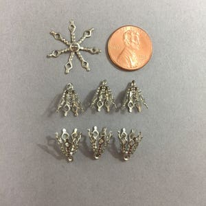 FILIGREE  bead caps. Sold by lots of 24 pieces.
