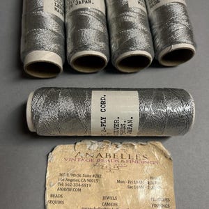 Cord. NOS. 2-PLY Lovely Silver metallic cord. Sold by spool.