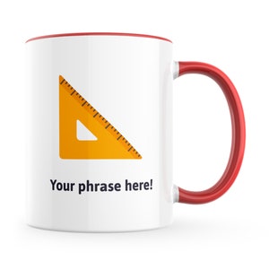 May include: White ceramic mug with a red rim and handle. The mug features a yellow protractor with black markings and the text "Your phrase here!" printed on the front.