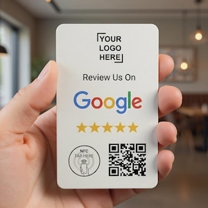 May include: A white card with rounded corners is held in a hand. The card has the text "YOUR LOGO HERE" at the top, followed by "Review Us On Google" and the Google logo. Below are five gold stars, a QR code, and an NFC tap symbol.