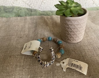 Darling horseshoe and bead bracelet with tags.