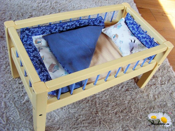 large wooden doll bed