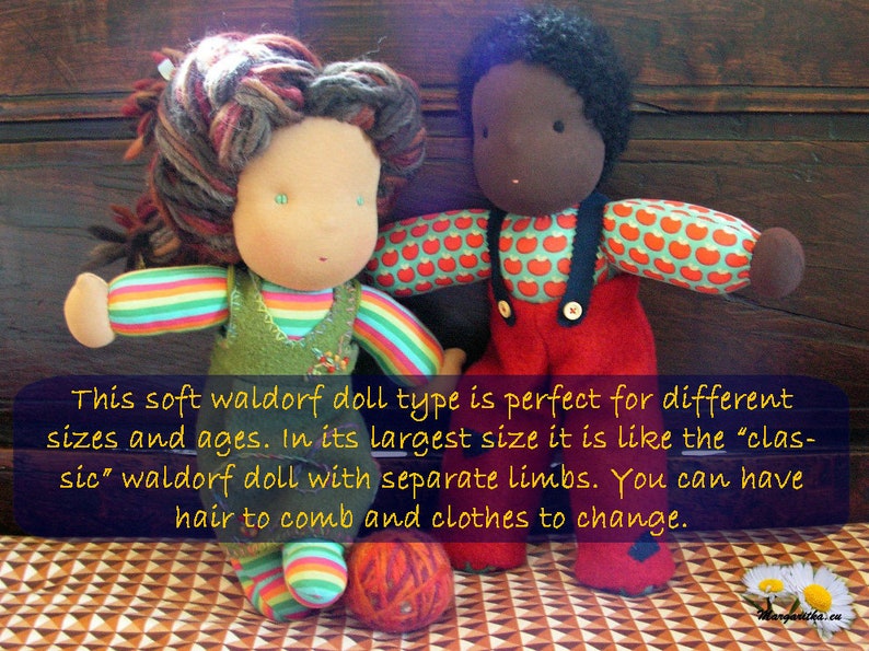 May include: Two Waldorf dolls, one with brown skin and red clothing with apple print, and one with light skin and rainbow striped clothing. Both dolls have yarn hair and are sitting on a patterned surface. "This soft waldorf doll type is perfect for different sizes and ages. In its largest size it is like the 'classic' waldorf doll with separate limbs. You can have hair to comb and clothes to change."