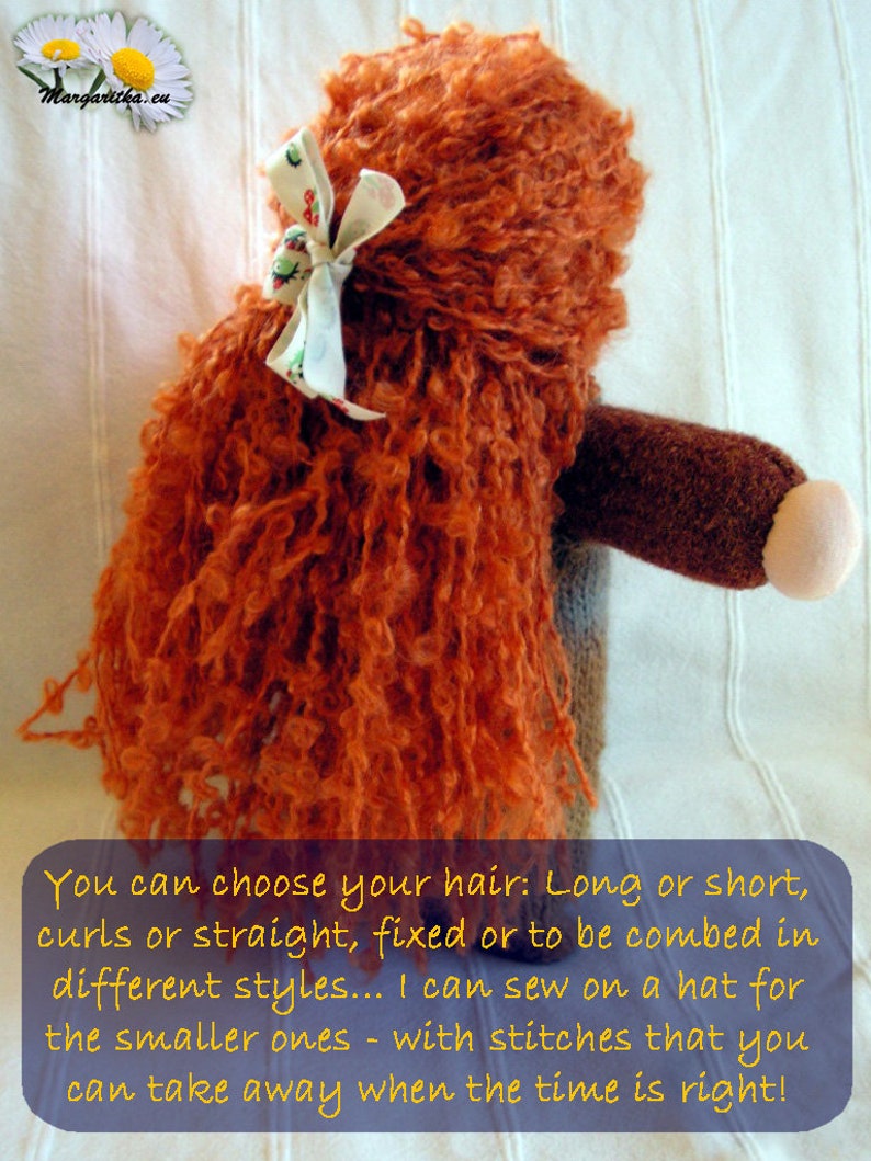 May include: A handmade doll with long, curly, orange hair. The doll has a brown body and a white bow in its hair. The doll is sitting on a white surface. You can choose your hair: Long or short, curls or straight, fixed or to be combed in different styles... I can sew on a hat for the smaller ones - with stitches that you can take away when the time is right!