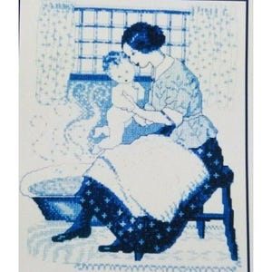 May include: A blue and white cross-stitch embroidery pattern depicting a person sitting on a stool, holding a small baby near a washbasin. The design features intricate needlework details, including a window with curtains in the background and a patterned skirt, rendered entirely in shades of blue thread on a white fabric background.