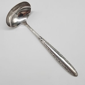 Vintage National Double Tested Silverplated Soup Ladle With Ornate Handle Design