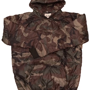 May include: A camouflage hooded sweatshirt with a quilted design. The sweatshirt has a black drawstring and a black ribbed hem.
