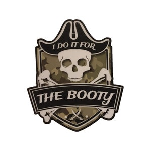 May include: A black and white skull and crossbones with a pirate hat on top. The skull is on a camouflage background with the text "I do it for the booty" in a black banner.