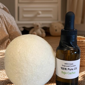 May include: A white wool dryer ball and a glass bottle of 100% pure Baja Cactus oil from Mill Creek Soap and Candles.