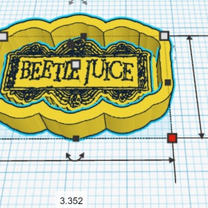 May include: A yellow 3D printed cookie cutter shaped like a cloud with the words "Beetle Juice" in black text inside. The cookie cutter is 8.51 cm wide and 5.62 cm tall.