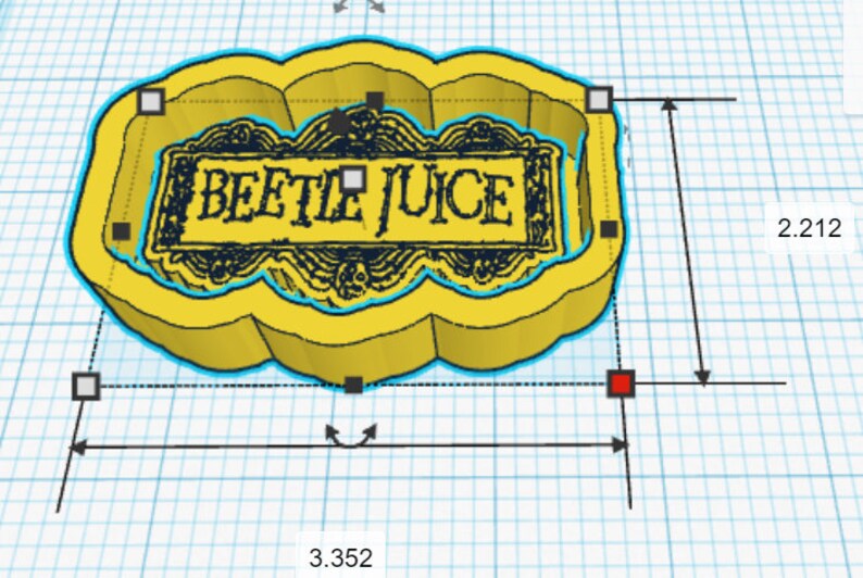 May include: A yellow 3D printed cookie cutter shaped like a cloud with the words "Beetle Juice" in black text inside. The cookie cutter is 8.51 cm wide and 5.62 cm tall.