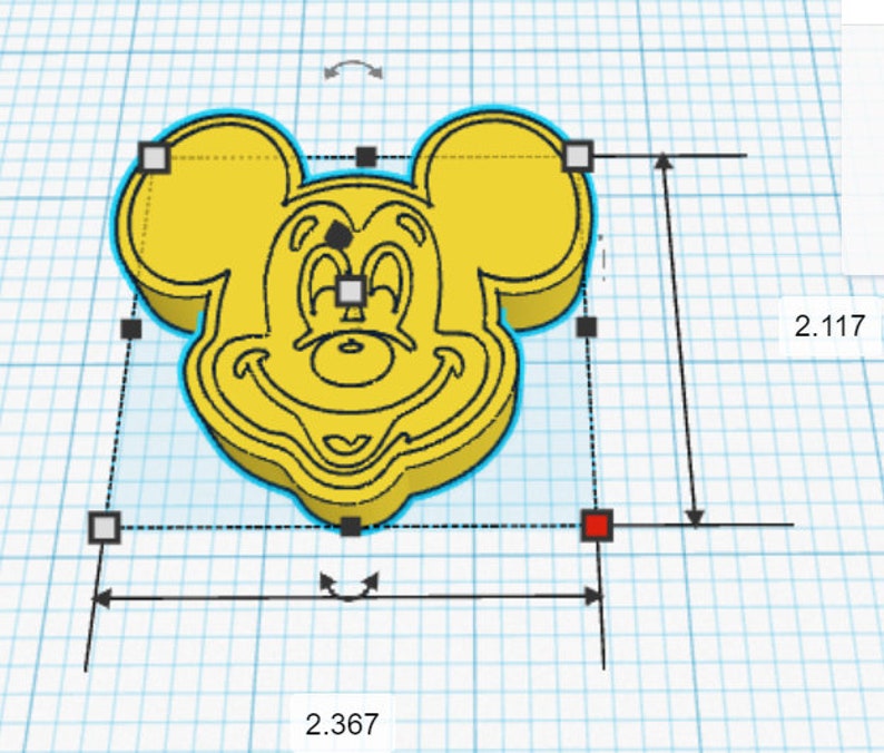 May include: A yellow 3D printed model of Mickey Mouse's head. The model is 2.367 inches wide and 2.117 inches tall.