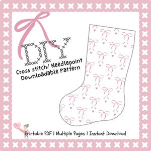 May include: A pink and white cross-stitch pattern for a Christmas stocking. The design features pink bows and hearts on a white background. The text "DIY Cross stitch/ Needlepoint Downloadable Pattern" is included.