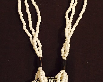 Beaded black and white necklace with circluar detail