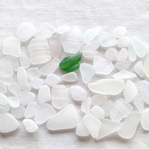 Destocking of white sea glass, polished glass in bulk, real sea glass more or less white .