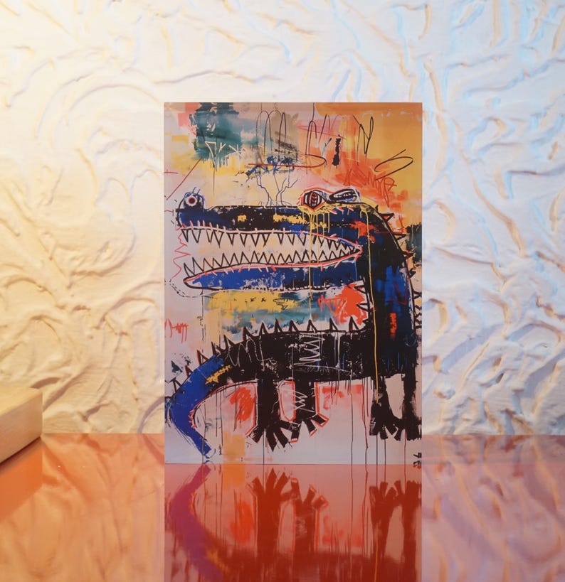 Puede incluir: Una pintura abstracta colorida de un cocodrilo negro con acentos azules y amarillos. El cocodrilo tiene una gran boca abierta con dientes afilados. El fondo es una mezcla de colores brillantes, incluyendo rojo, amarillo, verde y azul.